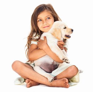 girl holding puppy thinking about lawn care services in Cumming