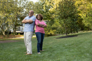 Couple on grass after Lawn Doctor provided Lawn Service in Rosedale