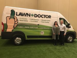 Owners standing in front of Lawn Doctor for lawn services in Naperville