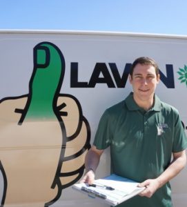 employee in front of lawn doctor van