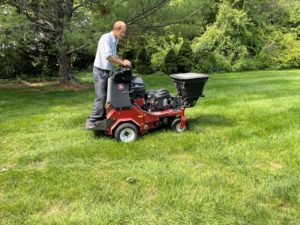 A man working on Lawn Treatment, lawn treatment Metro West 