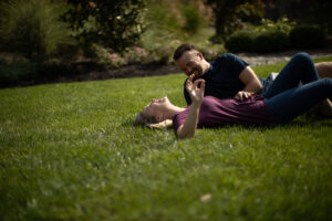 Couple on grass after Lawn Doctor provided Lawn Maintenance in Tannersville