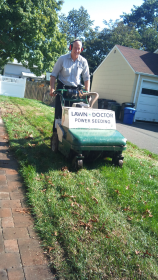 An employee at Lawn Doctor Wayne providing lawn service