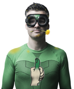 Funny male with goggles and green shirt with Lawn Doctor logo and dandelion in his mouth