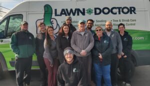 Lawn Doctor of Lower BuxMont employees by van