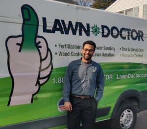 Lawn Doctor of Lower BuxMont technician by van