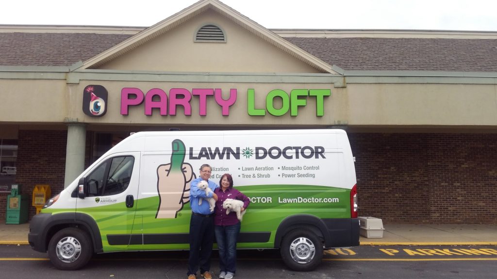 Lawn Doctor of Chardon Owners in front of van 