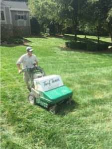 employee performing lawn care in Chattanooga