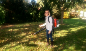 owner with lawn blower