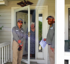 employees smiling with loyal customer