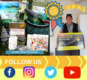 lawn care technician holding giveaway prize