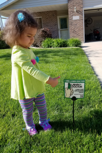 Little girl giving thumbs up for our lawn aeration in Griffith