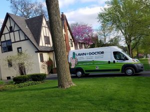 lawn doctor truck in front yard ready for springtime lawn care in La Grange