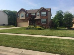 house with grass treated by lawn care services in West Chester 