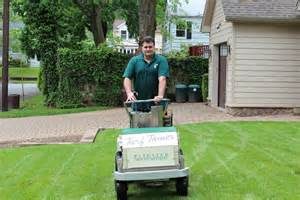 technician performing lawn seeding in Madison