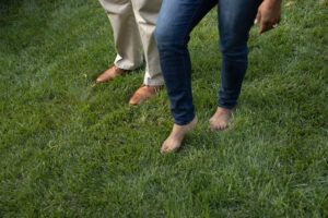 feet in grass after Lawn Doctor provided Lawn Aeration in Glen Head
