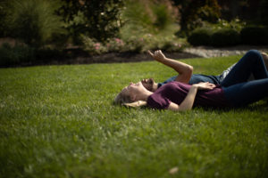 Image of a girls lying in lawn in Mahwah