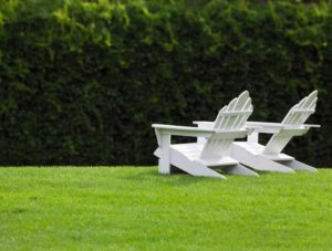 Chairs on green grass after Lawn Doctor provided Lawn Aeration in Southampton