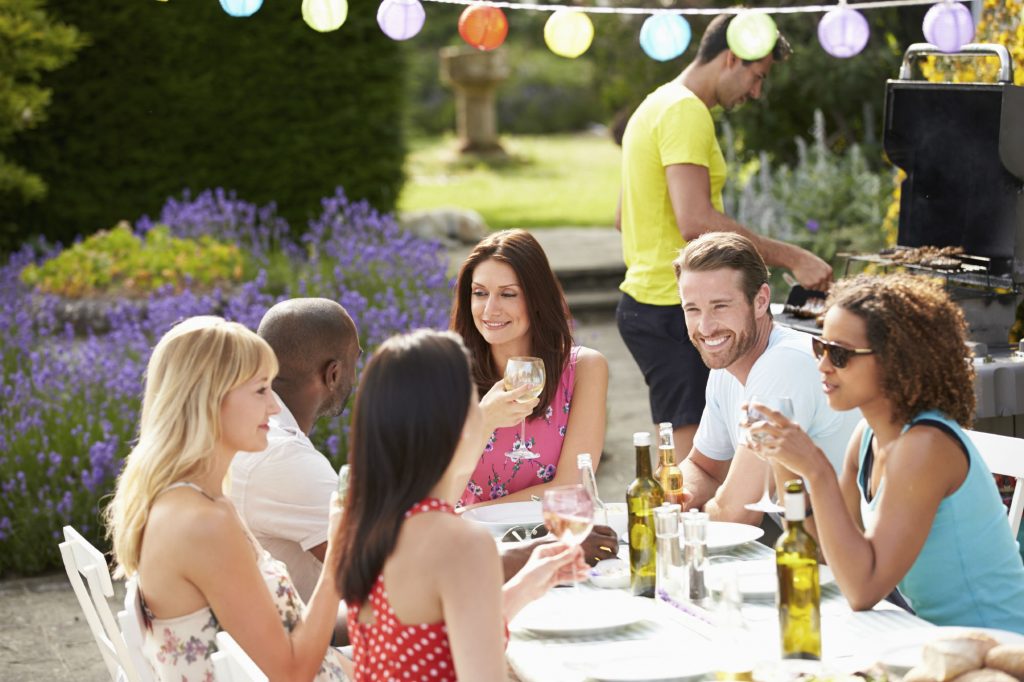 group of friends at an outdoor dinner party 
