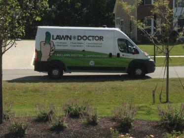 lawn seeding truck in front of grass in westerville