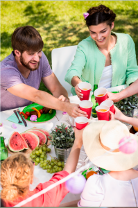 Family eating lunch at an outdoor table